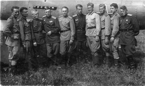 Soviet pilots wearing gymnastyorka uniforms